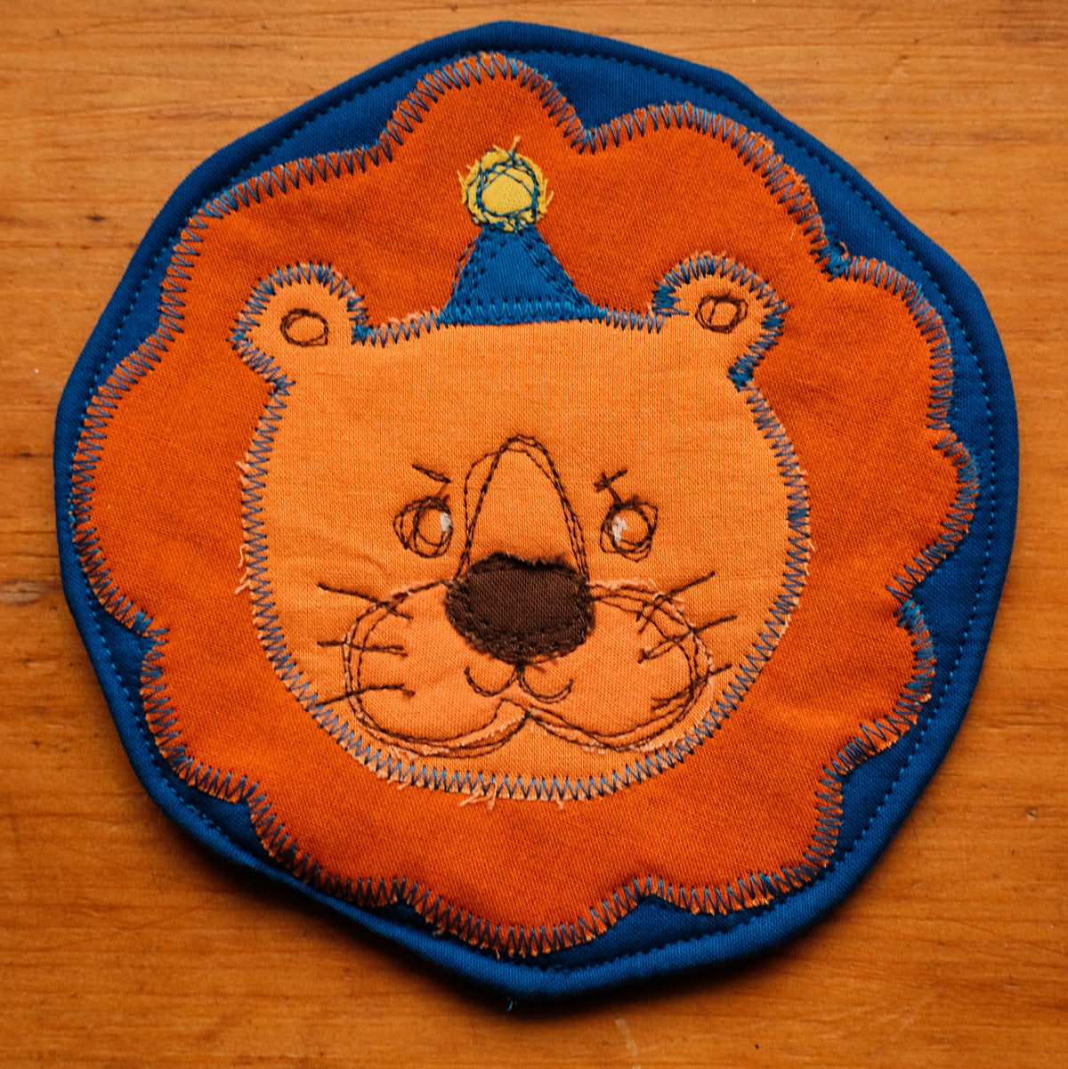 Sous-verre Clownimal Balthazar le lion sur fond bleu