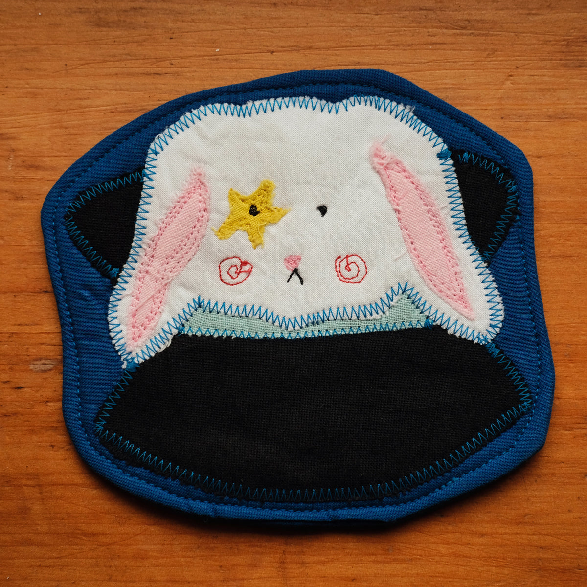 Sous-verre Clownimal Boris le lapin magicien sur fond bleu