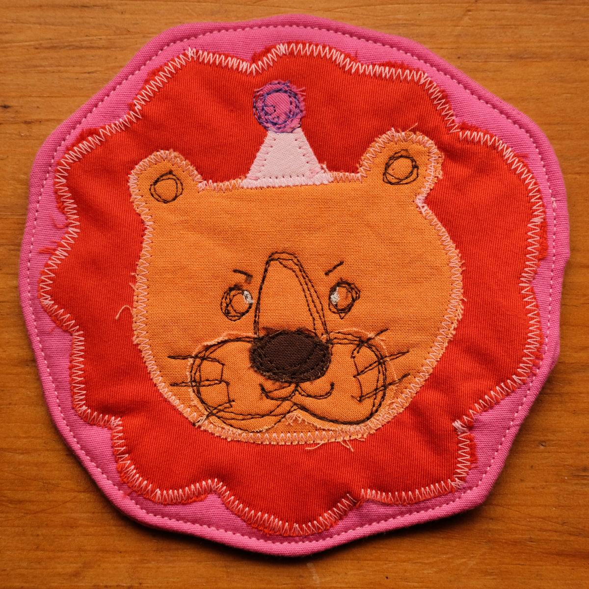 Sous-verre Clownimal Balthazar le lion sur fond rose