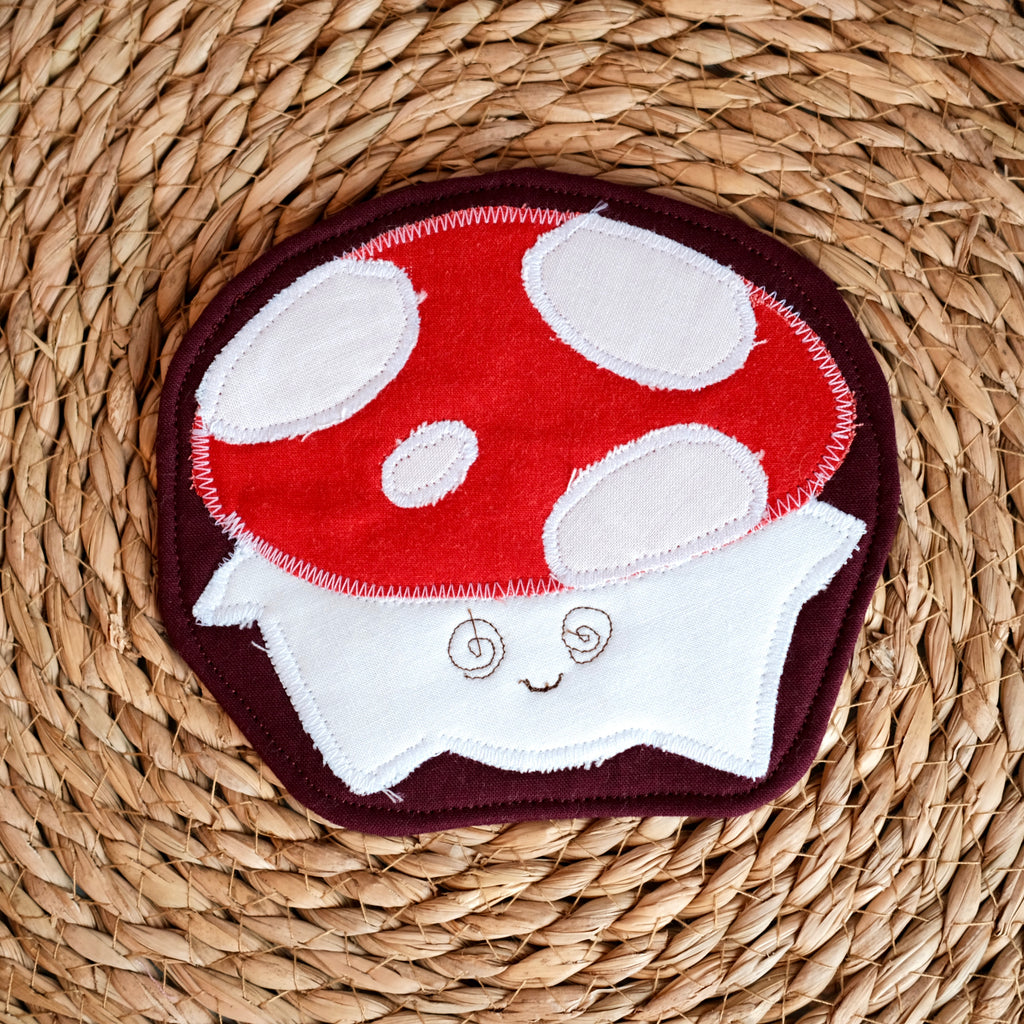 Sous-verre de la forêt Chantal le champignon, rouge et blanc sur fond bourgogne