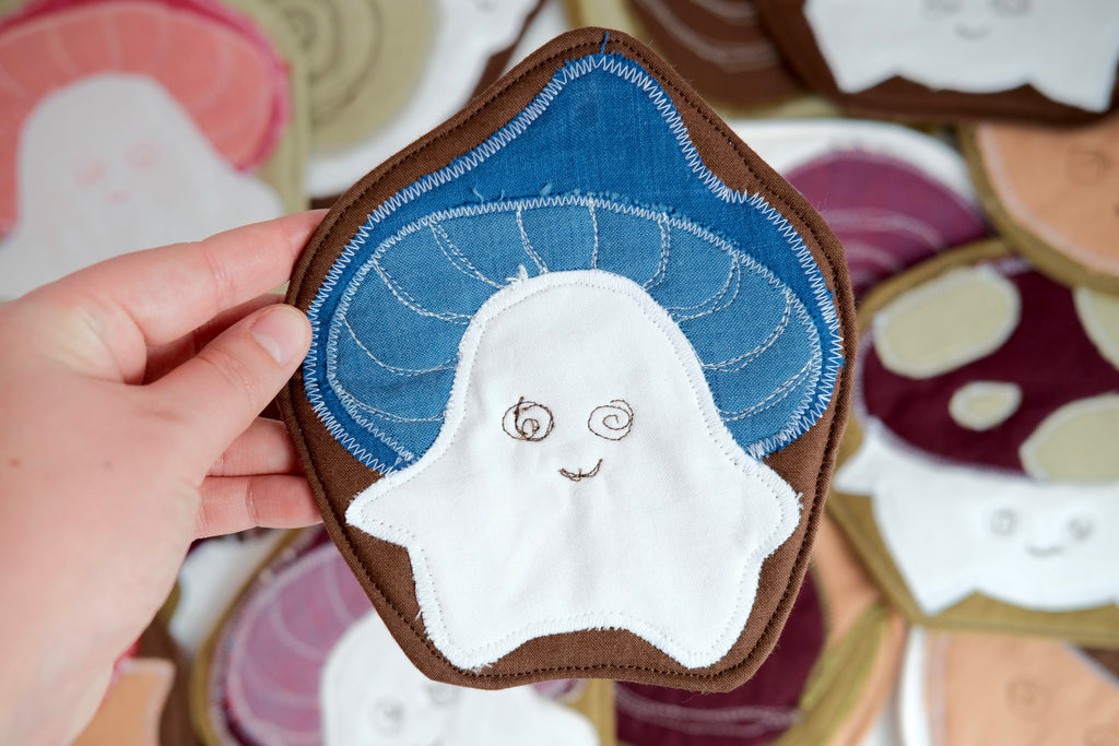 Forest Friend Marcel the Mushroom Coaster, Blue and White on Brown Background